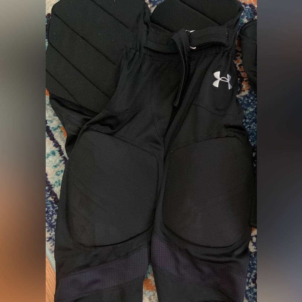Youth medium UA football pants